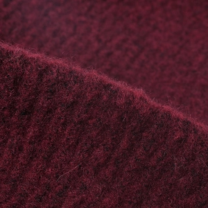 Deep burgundy wool knit beanie with soft plush texture for autumn and winter outdoor warmth