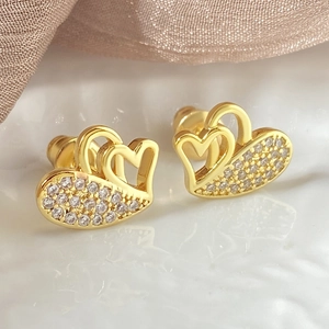 Luxurious double heart hollow stud earrings in gold with sparkling white zircon stones