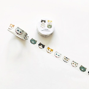Close-up of cute cartoon cat washi tape roll with illustrated decorative patterns
