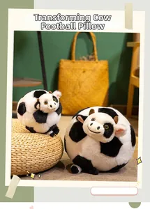 Macro shot of soft plush cow soccer pillow showcasing black and white spots and texture