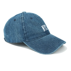 Close-up of NYC white embroidery detail on navy blue washed denim baseball cap