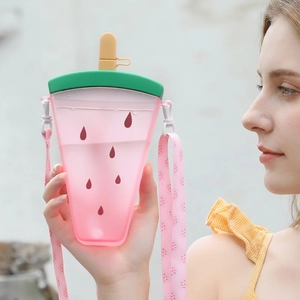 Watermelon shaped plastic straw cup with pink translucent body and adjustable carrying strap