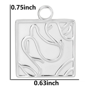 Macro shot showing dimensions of silver square patterned pendant in inches