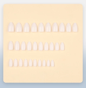 Flat lay showing 30 pieces of milky white almond shaped press-on gel nails in various sizes