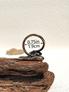 Detailed close-up showing the 0.75-inch inner diameter of this vintage handmade copper ring