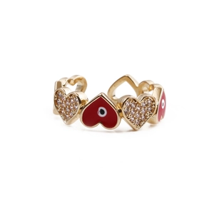 Detail of red heart enamel and white zircon paving on a gold-plated adjustable ring