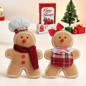 Pair of glowing plush gingerbread man figurines with chef hats and scarves for Xmas decor