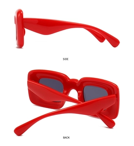 Side and back view of red futuristic wrap-around sunglasses with thick frames