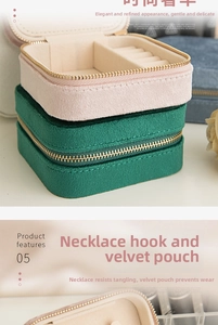 Detail of velvet jewelry box with necklace hooks, ring slots and secure gold zipper closure