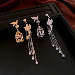 Vintage birdcage pearl tassel earrings in gold and silver finish with long chain dangles