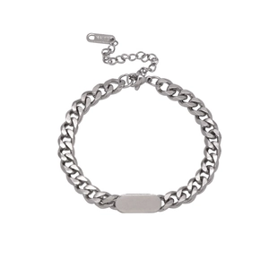 Polished stainless steel Cuban link bracelet with blank ID tag and lobster clasp detail