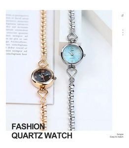 Detail of elegant gold and silver quartz watches featuring heart-shaped rhinestone straps
