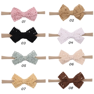 Detailed grid of eight assorted lace bow baby headbands in various soft pastel colors
