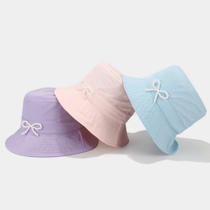 Women's quick-dry sun hat with pearl bow detail in purple, pink, and light blue colors