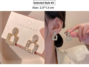 Detail of luxury geometric earrings with crystals and rectangular pendant 2.5x1.5cm