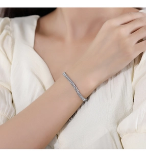 Close-up of S925 silver tennis bracelet featuring rectangular zircon stones on wrist