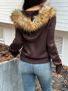 Women's brown knit hoodie sweater with faux fur collar shown from the back view