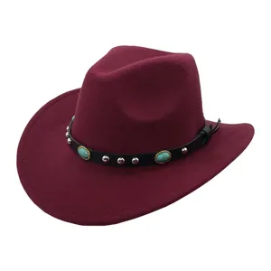 Macro detail of wine red felt cowboy hat with black leather band and turquoise gemstone
