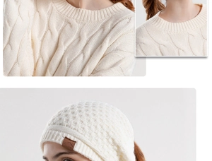 Detail of beige cable knit beanie with ear protection and mountain pattern leather patch