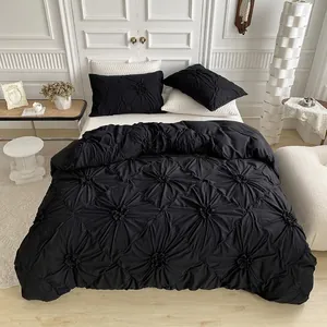 Black pinch pleat duvet cover set with 3D diamond texture and matching pillowcases