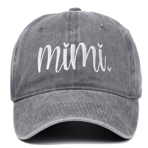 Close-up of white mimi embroidery on a vintage grey washed cotton baseball cap