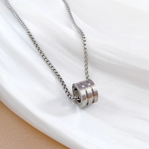 Polished silver titanium steel necklace with triple ring cylinder pendant on silk