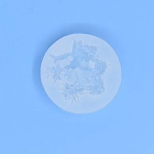 Blue circular silicone mold with intricate snowflake patterns for DIY cake baking and crafts