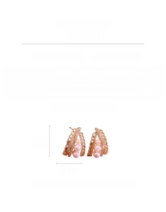 Detail view of rose gold teardrop earrings with zircons and pink faux pearls