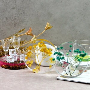 Handmade resin coasters with embedded dried flowers for elegant home table decoration
