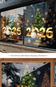 Detail of 2026 gold Christmas tree and snowman static cling stickers for glass display