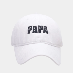 Detailed close-up of blue PAPA embroidery with fishing motifs on a white cotton baseball cap