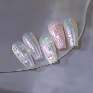Detailed view of aurora pearl press-on nails with 3D beads and ocean line art patterns