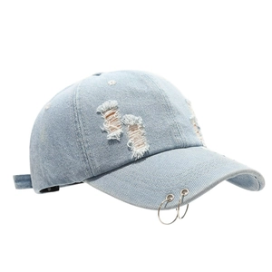 Distressed light blue denim baseball cap with iron rings and vintage street style look