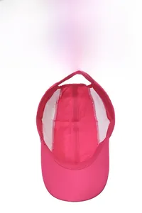 Pink quick-dry sports cap detail showing breathable white mesh lining and interior structure