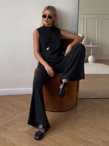 Women's black sleeveless high-neck top and wide-leg pants lounge set with soft drape