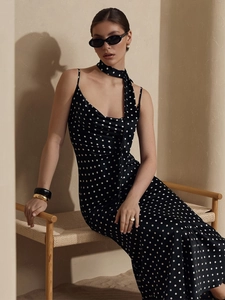 Elegant polka dot halter neck maxi dress with silk-like sheen and slim fit design