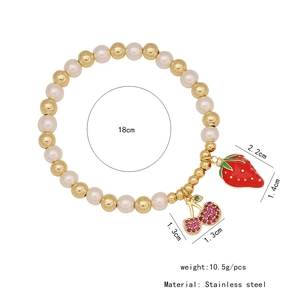 Beaded bracelet detail with strawberry charms and dimension annotations on white background