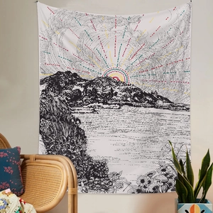 Detail of sunrise tapestry with black and white line art and colorful dotted sun on wall