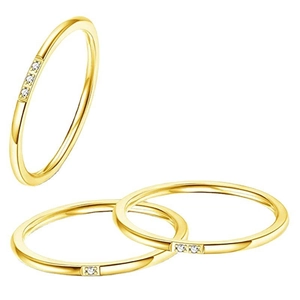 Detailed view of three minimalist 18K gold-plated rings with micro-set zircon accents