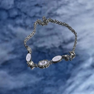 Punk style silver chain necklace with butterfly pendant and sparkling white rhinestones