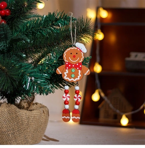 Gingerbread man wooden Christmas tree ornament with beaded long legs on a green branch