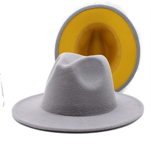 Detail showing two-tone felt fedora hat with gray exterior and bright yellow interior lining