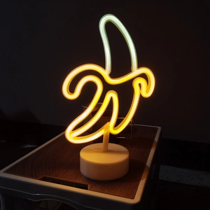 Banana neon sign with base for desk decoration, glowing yellow and white LED light
