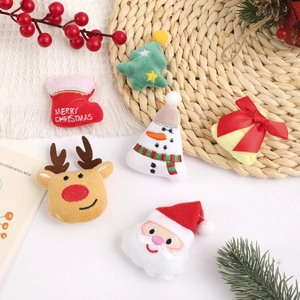 Plush Christmas brooches featuring Santa, reindeer, and snowman on a festive background