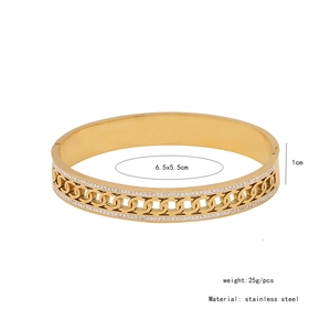 Detail shot of hollow link gold bangle with inset crystals and size specifications