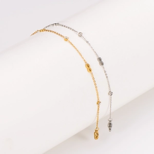 Infinity gold and silver stainless steel anklets with small crystals on a display