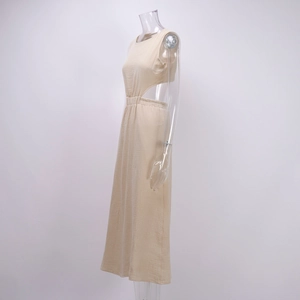 Detailed side view of beige sleeveless dress featuring waist cut-outs and crinkle fabric
