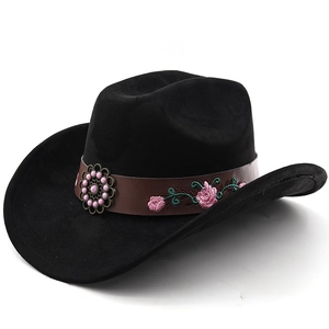 Detailed embroidery of pink roses and metal floral ornament on black felt cowboy hat