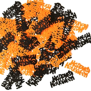 Detail of orange and black Happy Halloween confetti with pumpkin motifs for party decor