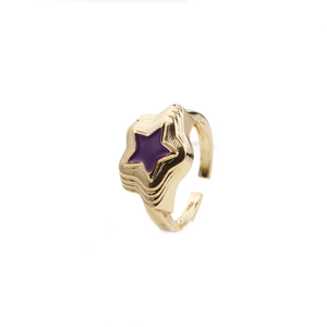 Golden star ring with purple enamel and zircon inlay on a clean white background